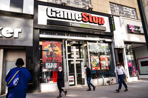 FILE - Pedestrians pass a GameStop store on 14th Street at Union Square, Thursday, Jan. 28, 2021, in the Manhattan borough of New York. The GameStop saga has been portrayed as a victory of the little guy over Wall Street giants but not everyone agrees, including some lawmakers in Washington. The House Financial Services Committee is ready to dig into the confounding episode at a hearing on Thursday, Feb. 18. (AP Photo/John Minchillo, File) PHOTO CREDIT: John Minchillo