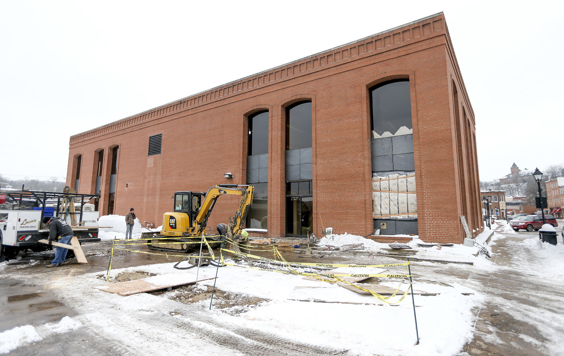 Employees of Redmond Construction Corp. work on the exterior of the future home of the PhamaCann/ Verilife dispensary located at the intersection of Commerce and Perry streets in Galena, Ill., on Wednesday. PHOTO CREDIT: Dave Kettering