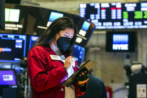 In this photo provided by the New York Stock Exchange, trader Ashley Lara works on the floor, Monday, March 1, 2021. Stocks are rising across the board on Wall Street as traders welcomed a move lower in long-term interest rates in the bond market. Investors were also watching Washington as a big economic stimulus bill moved to the Senate. (Courtney Crow/New York Stock Exchange via AP) PHOTO CREDIT: Courtney Crow