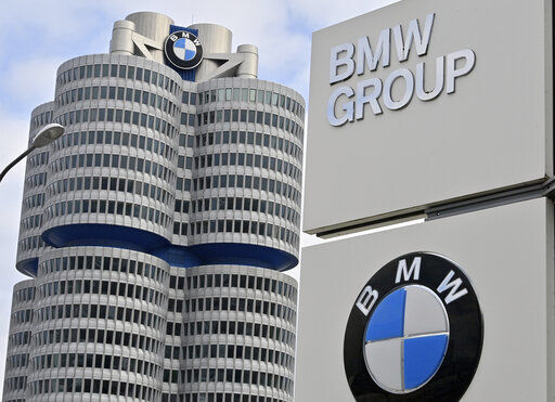 The BMW Group headquarters are pictured in Munich, Germany, Wednesday, March 16, 2021. German automaker BMW said Wednesday it intends to speed up the rollout of new electric cars, vowing to bring battery powered models to 50% of global sales by 2030. (Peter Kneffel/dpa via AP) PHOTO CREDIT: Peter Kneffel