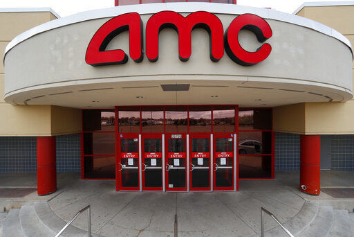 AMC Theatres says it will have 98% of its U.S. movie theaters open on Friday, with more expected to open by March 26. Movie theaters all over shuttered their doors a year ago as the coronavirus pandemic swept the globe.  PHOTO CREDIT: Paul Sancya