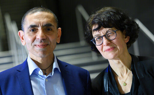 Husband and wife Ugur Sahin, second from right, and Ozlem Tureci, second from left, the founders of the coronavirus vaccine developer BioNTech, pose for a photo at an Axel Springer Award ceremony for the research couple broadcast on the Internet, Thursday, March 18, 2021. (Bernd von Jutrczenka/dpa via AP, Pool) PHOTO CREDIT: Bernd von Jutrczenka