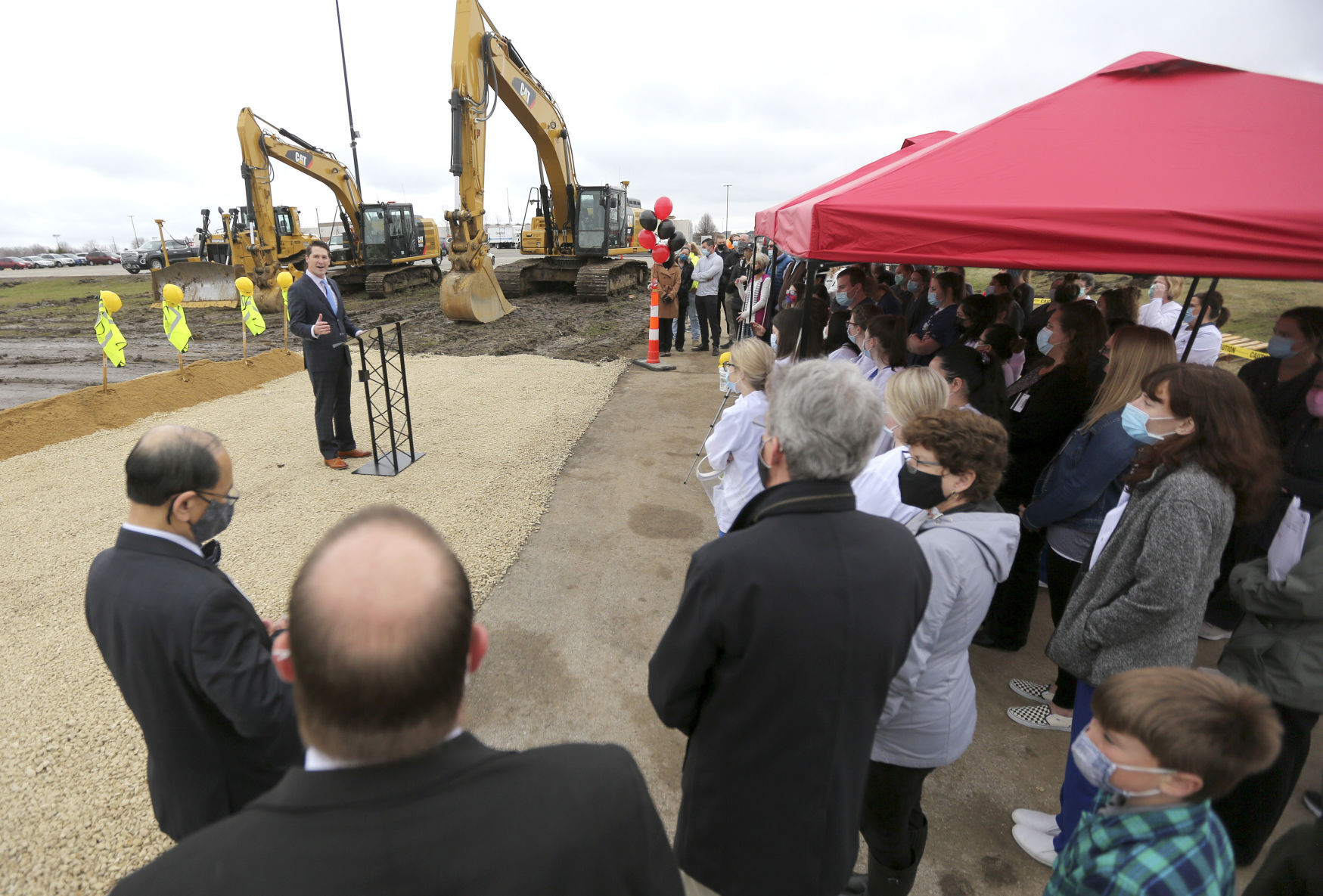 Wes Schulte, managing partner with Merit Development, speaks Thursday during a groundbreaking for the College Suites development that will be constructed on the edge of the Northeast Iowa Community College campus in Peosta, Iowa. PHOTO CREDIT: Dave Kettering