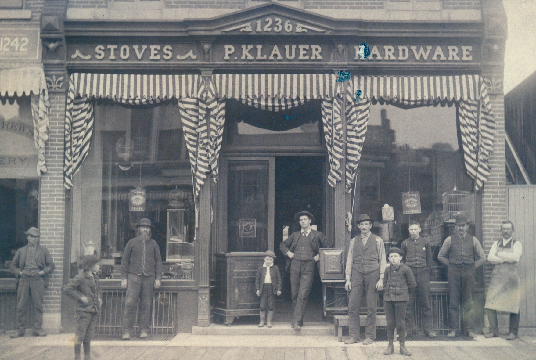 Klauer Manufacturing storefront (circa 1890), east side of Iowa Street between 12th and 13th. Standing in the doorway is William H. Klauer, son of the founder, who was the impetus behind transforming the business from a local shop to a large manufacturer. PHOTO CREDIT: Contributed