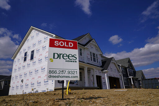 FILE - In this Sept. 25, 2020 file photo, a "sold" sign sits on a lot as new home construction continues in Westfield, Ind. Mortgage rates fell for the first time in more than two months as buyers continue to be stifled by high prices and limited supply. (AP Photo/Michael Conroy, File) PHOTO CREDIT: Michael Conroy
