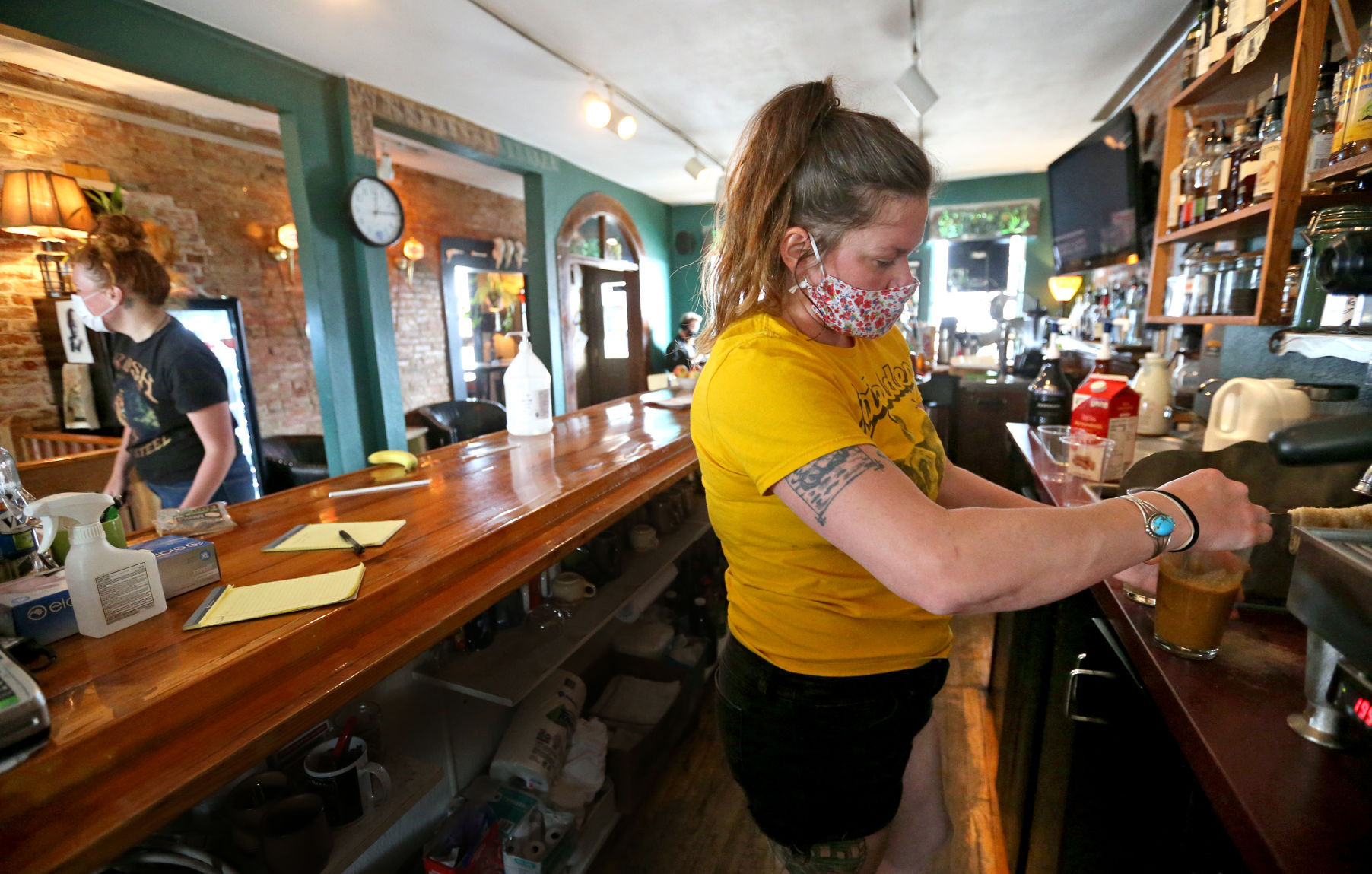 Co-owner Trish Jansen makes a drink for a customer at Monk’s Kaffee Pub, which received a $20,000 grant via an Iowa initiative. PHOTO CREDIT: JESSICA REILLY, Telegraph Herald