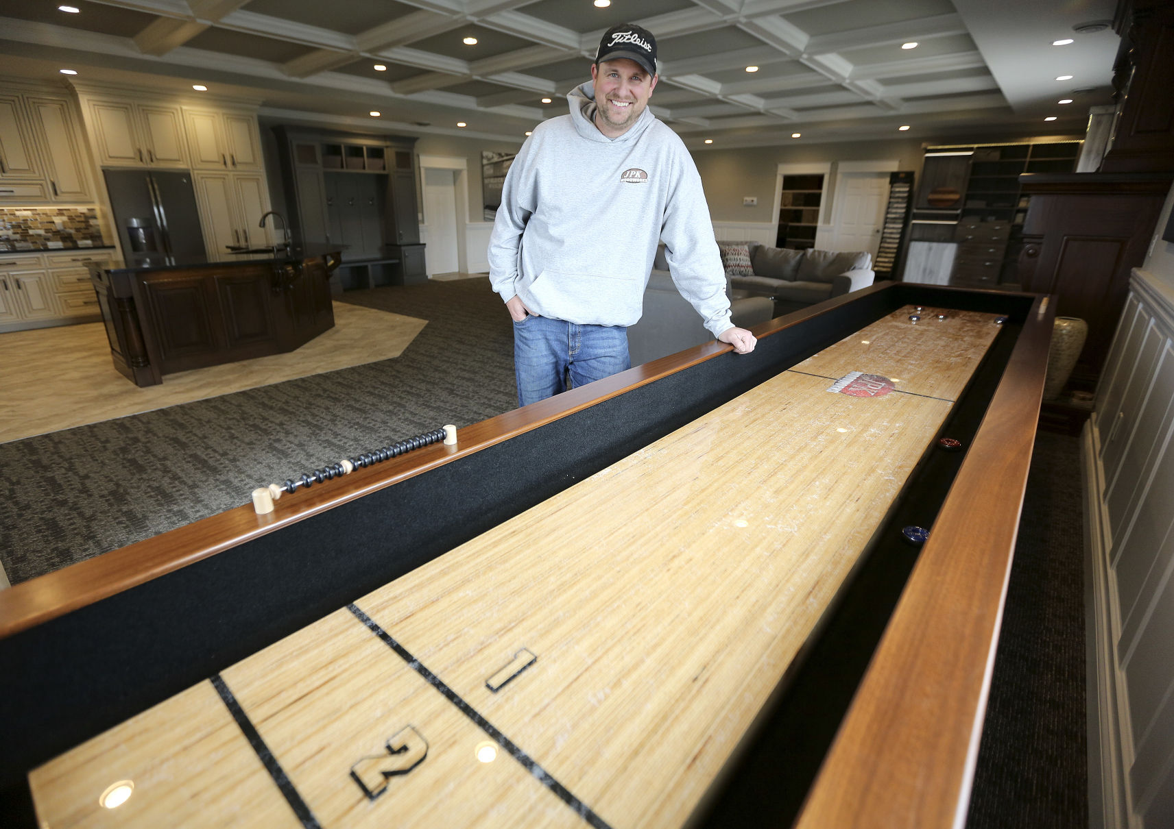 Jon Kluck, owner of JPK Woodworks, stands in his showroom Monday at 8005 Seippel Court in Dubuque.    PHOTO CREDIT: Dave Kettering