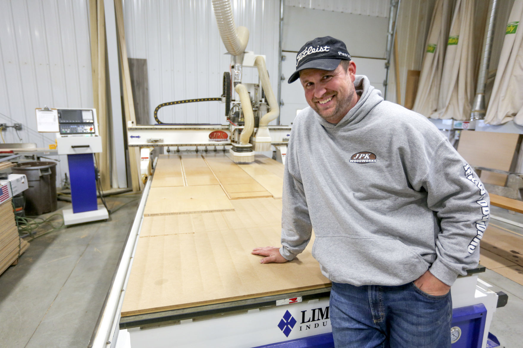 Jon Kluck, the owner of JPK Woodworks, shows the inside of his business at 8005 Seippel Court on Monday.    PHOTO CREDIT: Dave Kettering