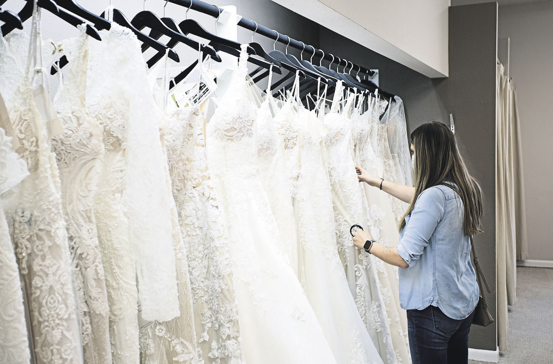 Taylor Tamling-Thurn looks for dresses at Brides & Weddings in Manchester, Iowa. PHOTO CREDIT: Stephen Gassman