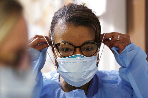 Medical providers might soon return to using one medical N95 mask per patient, a practice that was suspended during the pandemic due to deadly supply shortages.  PHOTO CREDIT: Elaine Thompson