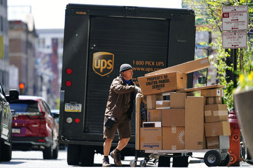 A surge in the volume of deliveries that arrived with the start of the pandemic has not eased at UPS, where consolidated average daily volume jumped 14.3% in the first quarter. PHOTO CREDIT: Matt Rourke