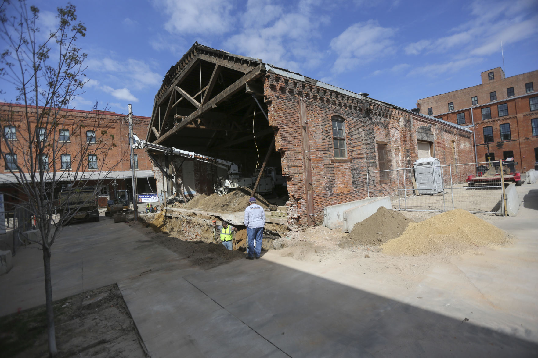 Crews work on the Rouse & Dean Foundry building at the corner of Washington and East 10th streets in Dubuque. PHOTO CREDIT: Dave Kettering
