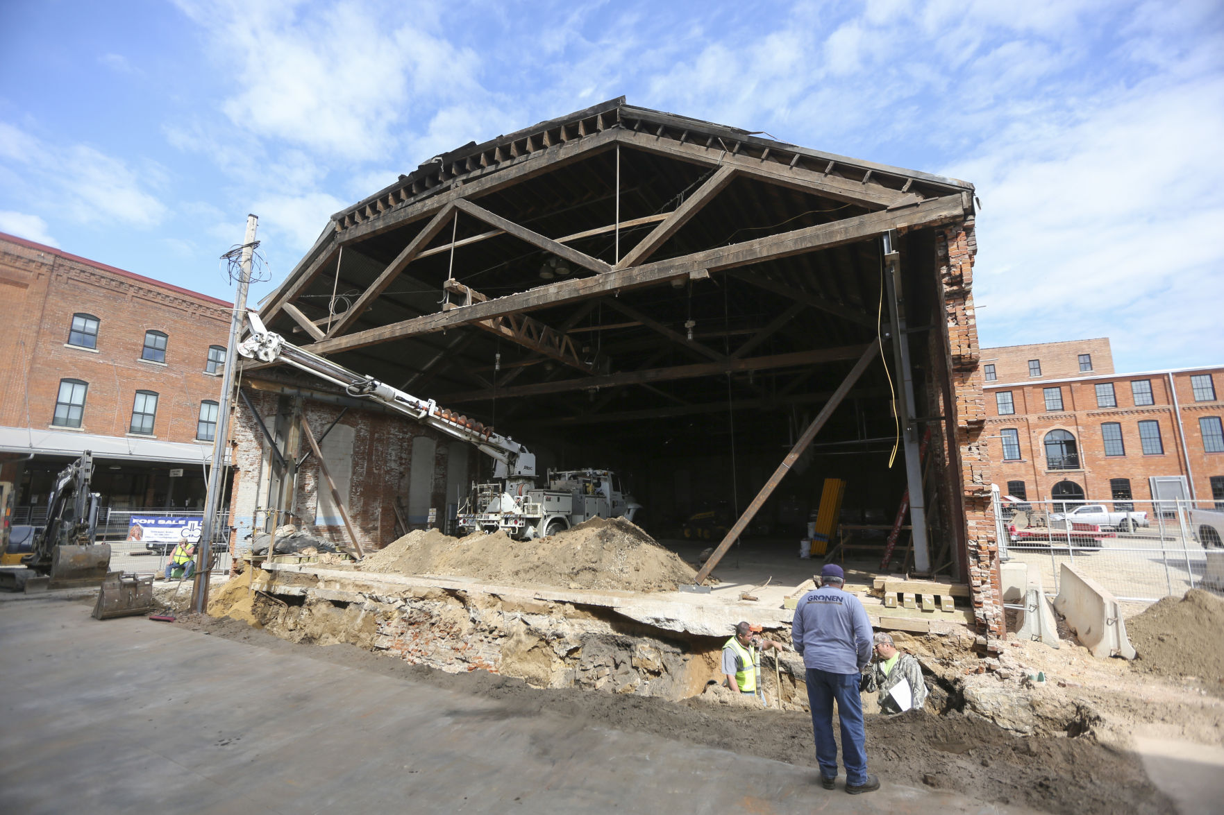 Crews work on the Rouse & Dean Foundry building, a historic structure being redeveloped at the corner of Washington and East 10th streets in Dubuque. PHOTO CREDIT: Dave Kettering
