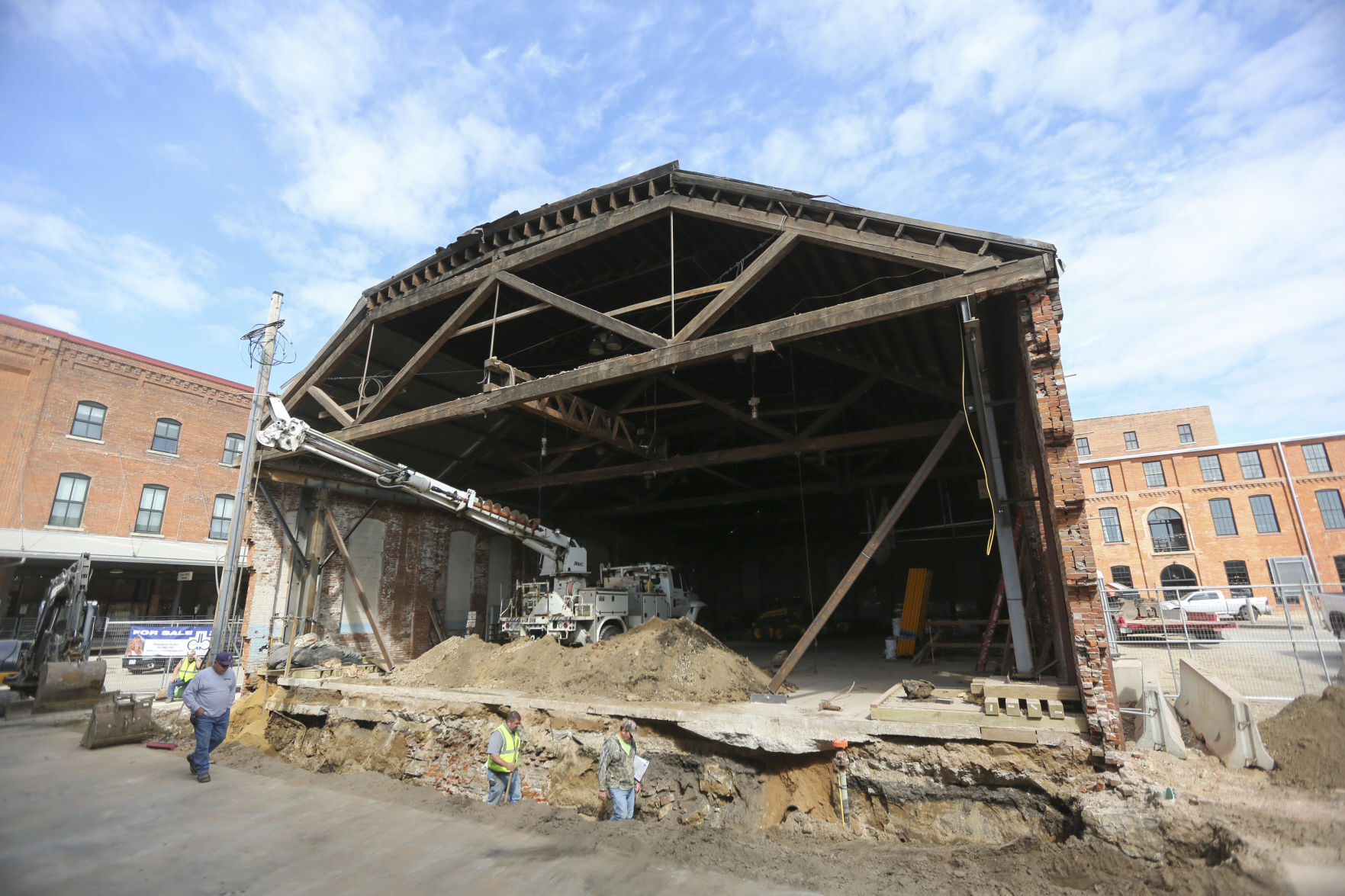 Crews work on the Rouse & Dean Foundry building, a historic structure being redeveloped at the corner of Washington and East 10th streets in Dubuque. PHOTO CREDIT: Dave Kettering