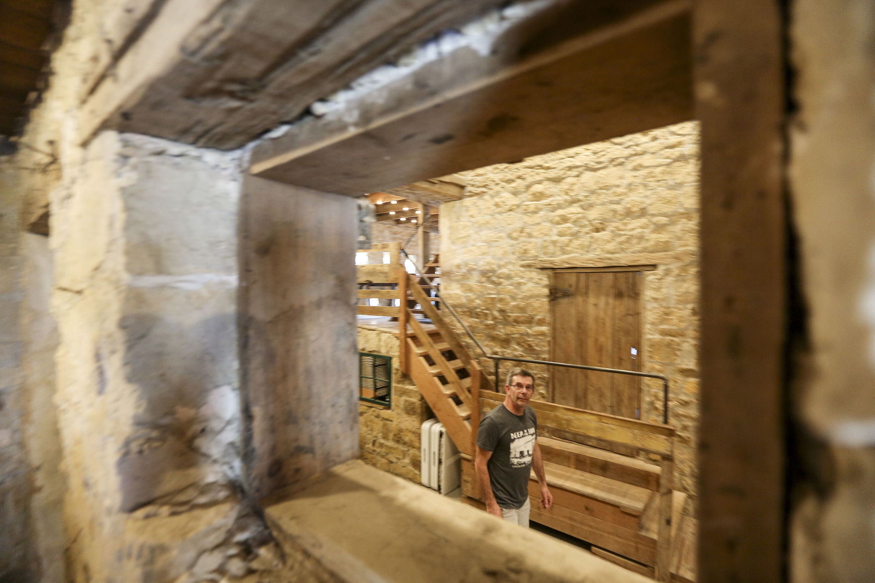 Don Vize, co-owner of the Gehlen House Inn and Barn, walks through the historic barn located in St. Donatus, Iowa, on Sunday, May 3, 2021. PHOTO CREDIT: Dave Kettering