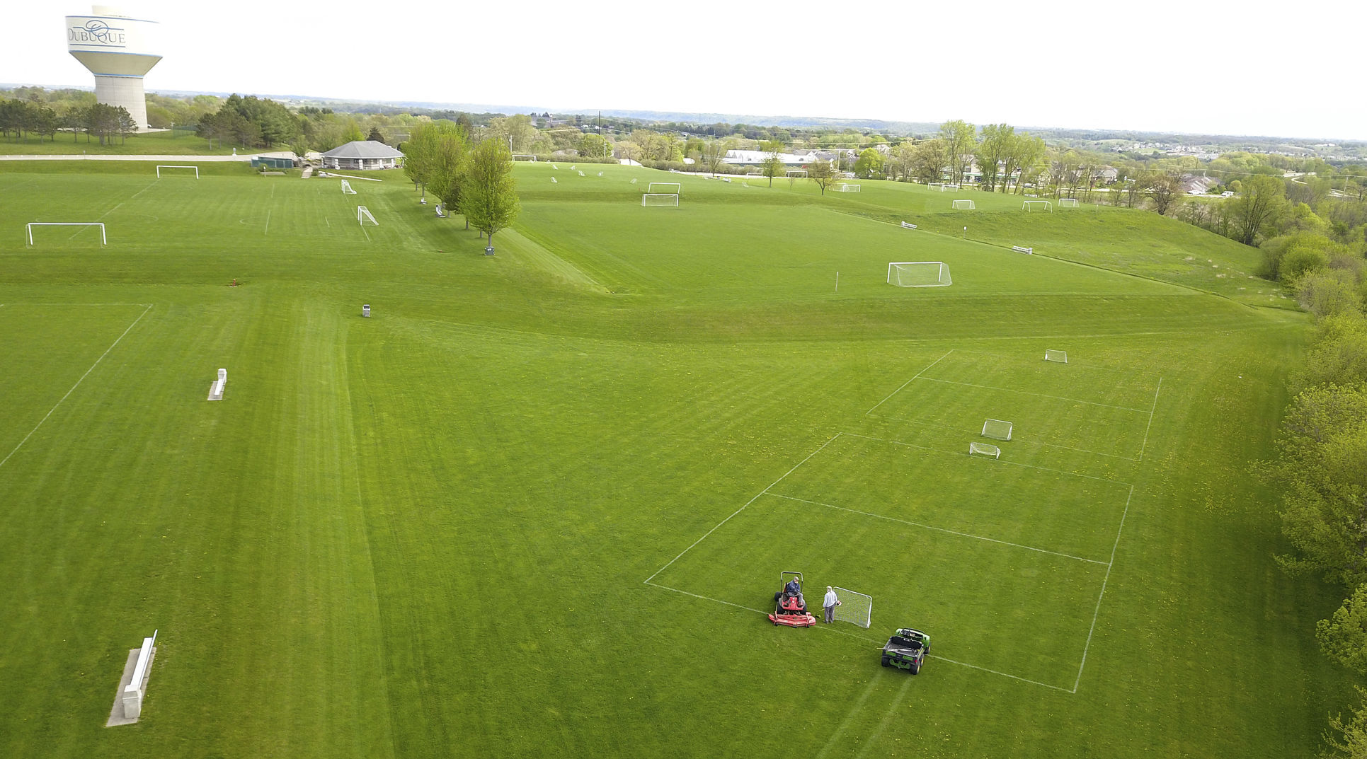 Workers groom one of the soccer fields at the Dubuque Soccer Complex on Tuesday. Dubuque Community Schools leaders are looking to sell the property to the Dubuque Soccer Alliance when the current lease expires. PHOTO CREDIT: Dave Kettering