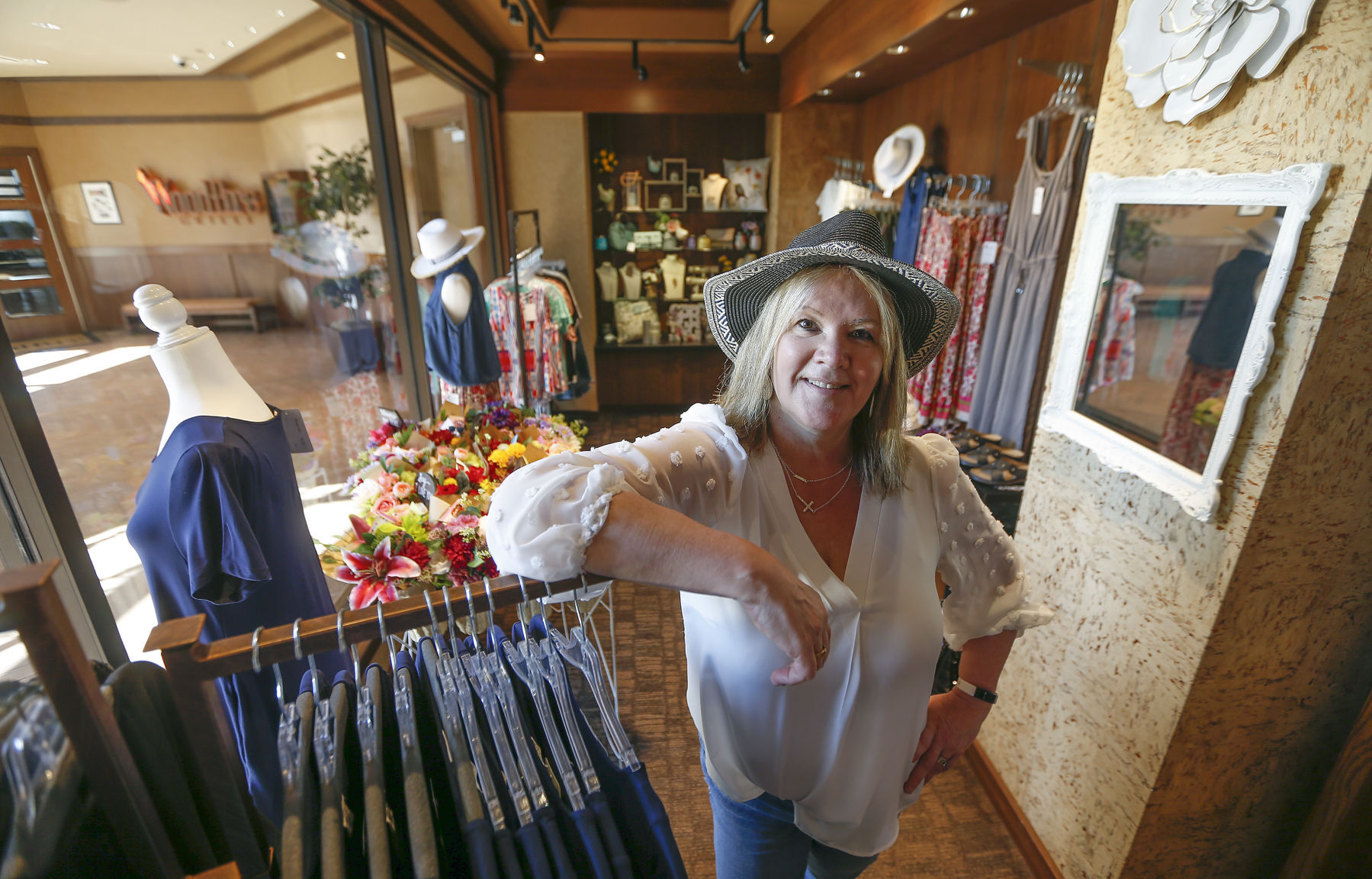 Tracy Gloeckner, owner of Dirt Road Darlings Boutique in Dubuque, recently opened her new satellite shop inside Diamond Jo Casino in Dubuque. The store sells a variety of women’s clothes and accessories.    PHOTO CREDIT: Dave Kettering