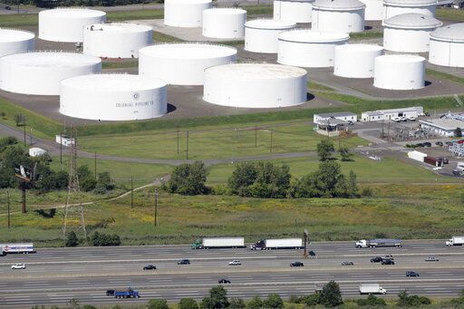 FILE - In this Sept. 8, 2008 file photo traffic on I-95 passes oil storage tanks owned by the Colonial Pipeline Company in Linden, N.J. A major pipeline that transports fuels along the East Coast says it had to stop operations because it was the victim of a cyberattack. Colonial Pipeline said in a statement late Friday that it “took certain systems offline to contain the threat, which has temporarily halted all pipeline operations, and affected some of our IT systems.” (AP Photo/Mark Lennihan, File) PHOTO CREDIT: Mark Lennihan