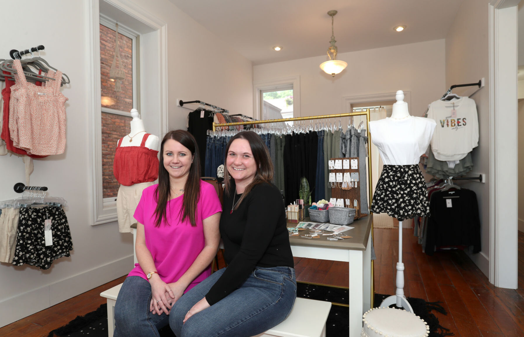 Katie Martin (left) and Brittany Harbert will soon open their shop, KB&Co. Boutique, at 331 Bluff St. in Dubuque.    PHOTO CREDIT: Stephen Gassman
