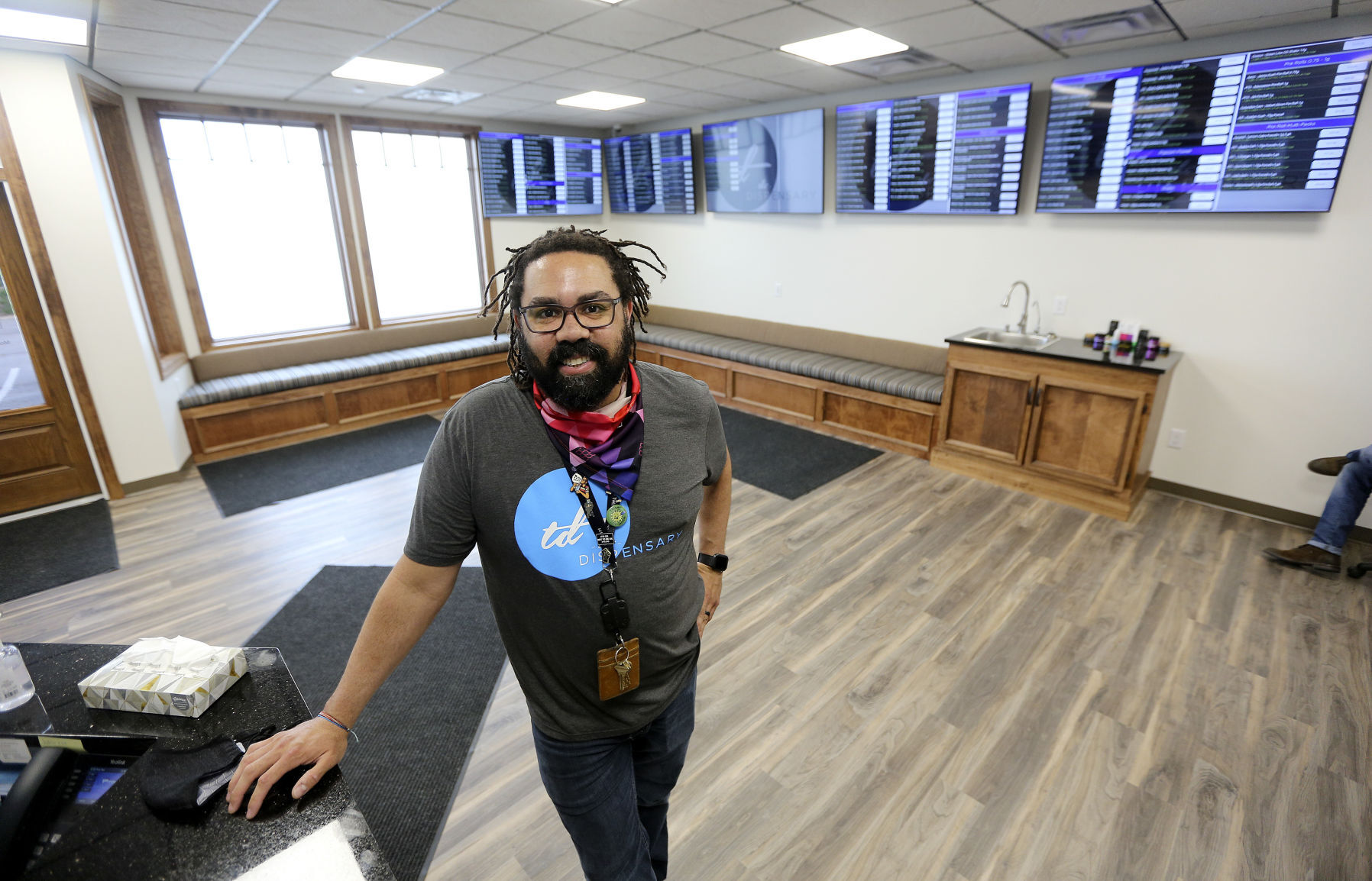 Joshua Perkins, general manager of The Dispensary East Dubuque, stands inside the store’s lobby. The business opened last Saturday. PHOTO CREDIT: Dave Kettering