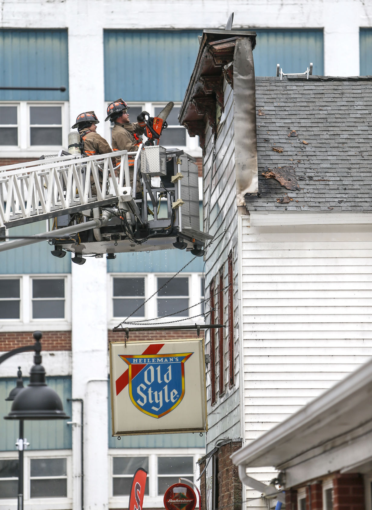 Firefighters look for hot spots after battling a blaze at 101 Jefferson St. in Hanover, Ill., on Wednesday, May 19, 2021. PHOTO CREDIT: Dave Kettering