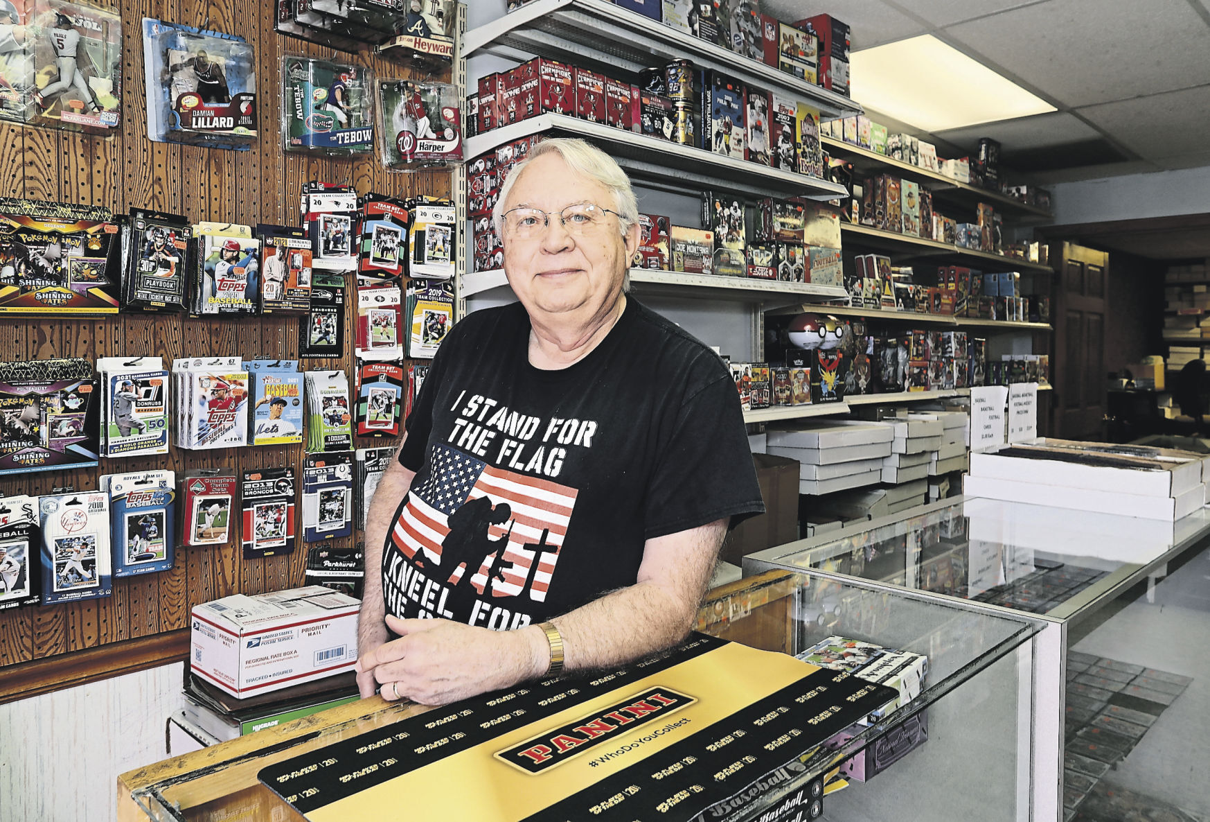 Tri-State Baseball Cards & Shows owner David Orr displays some of his cards and collectibles. The sports card industry has grown over the past year, and Orr said that was true at his Dubuque store. PHOTO CREDIT: Stephen Gassman