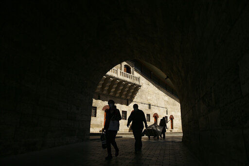 People walk through a tunnel in Istanbul, Tuesday, May 25, 2021.(AP Photo/Emrah Gurel) PHOTO CREDIT: Emrah Gurel