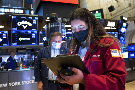 In this photo provided by the New York Stock Exchange, trader Ashley Lara works on the trading floor, Tuesday, May 25, 2021. Stocks were slightly higher in early trading Tuesday, adding to gains from the day before as technology companies and homebuilders helped push the market higher. (Nicole Pereira/New York Stock Exchange via AP) PHOTO CREDIT: Nicole Pereira