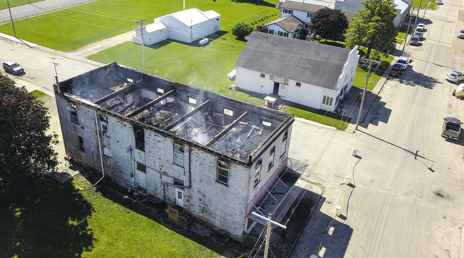 Fire still smolders after the building that housed the Painted Horse Saloon and second-floor apartments at 268 Jess St. in Bernard, Iowa caught fire in the early morning hours Wednesday, May 26, 2021. PHOTO CREDIT: Dave Kettering