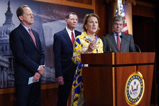 Sen. Shelley Moore Capito speaks at the Capitol today as from left, Sen. Pat Toomey, R-Pa., Sen. Barrasso, R-Wy. and Sen. Roy Blunt, R-Mo., look on. Republican senators outlined a $928 billion infrastructure proposal today, a counteroffer to President Joe Biden