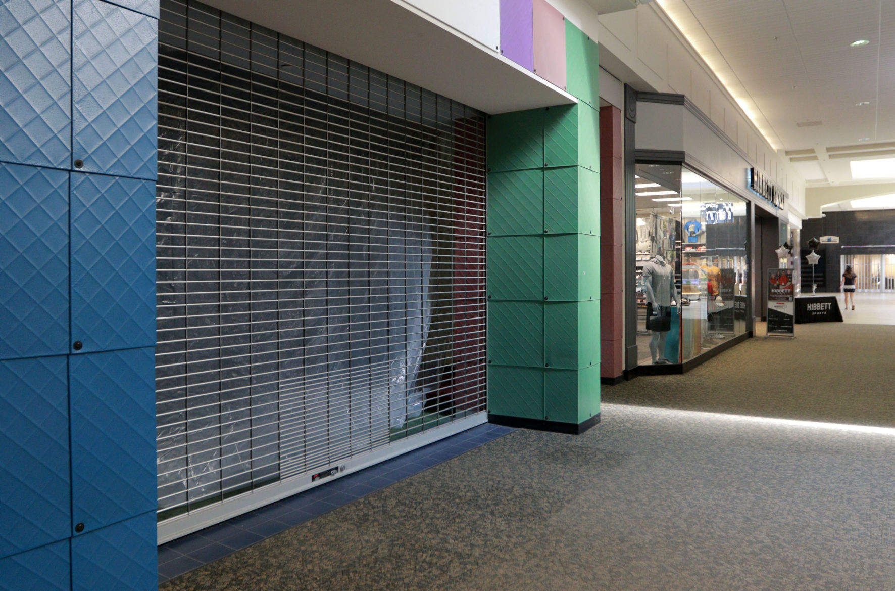A storefront sits empty at Kennedy Mall in Dubuque. Shifting trends in retail have put a higher priority for brick-and-mortar locations to offer an in-person “experience” and to provide services that cannot be duplicated online. PHOTO CREDIT: Katie Goodale