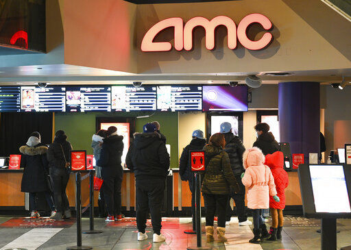 People line up for movie tickets at a reopened AMC theater in New York. AMC is launching AMC Investor Connect, an initiative that will put the company in direct communication with its individual shareholders. PHOTO CREDIT: Evan Agostini