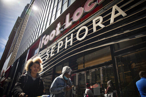 People walk outside a Sephora store in New York. The beauty retailer recently announced a commitment to devote at least 15% of its store shelves to Black-owned brands. PHOTO CREDIT: Robert Bumsted