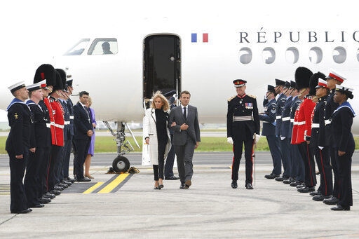 French president Emmanuel Macron and his wife Brigitte Macron arrive at Cornwall Airport in Newquay, England, Friday June 11, 2021, ahead of the G7 summit. Leaders of the G7 begin their first of three days of meetings on Friday in Carbis Bay, in which they will discuss COVID-19, climate, foreign policy and the economy. (Stefan Rousseau/Pool via AP) PHOTO CREDIT: Stefan Rousseau