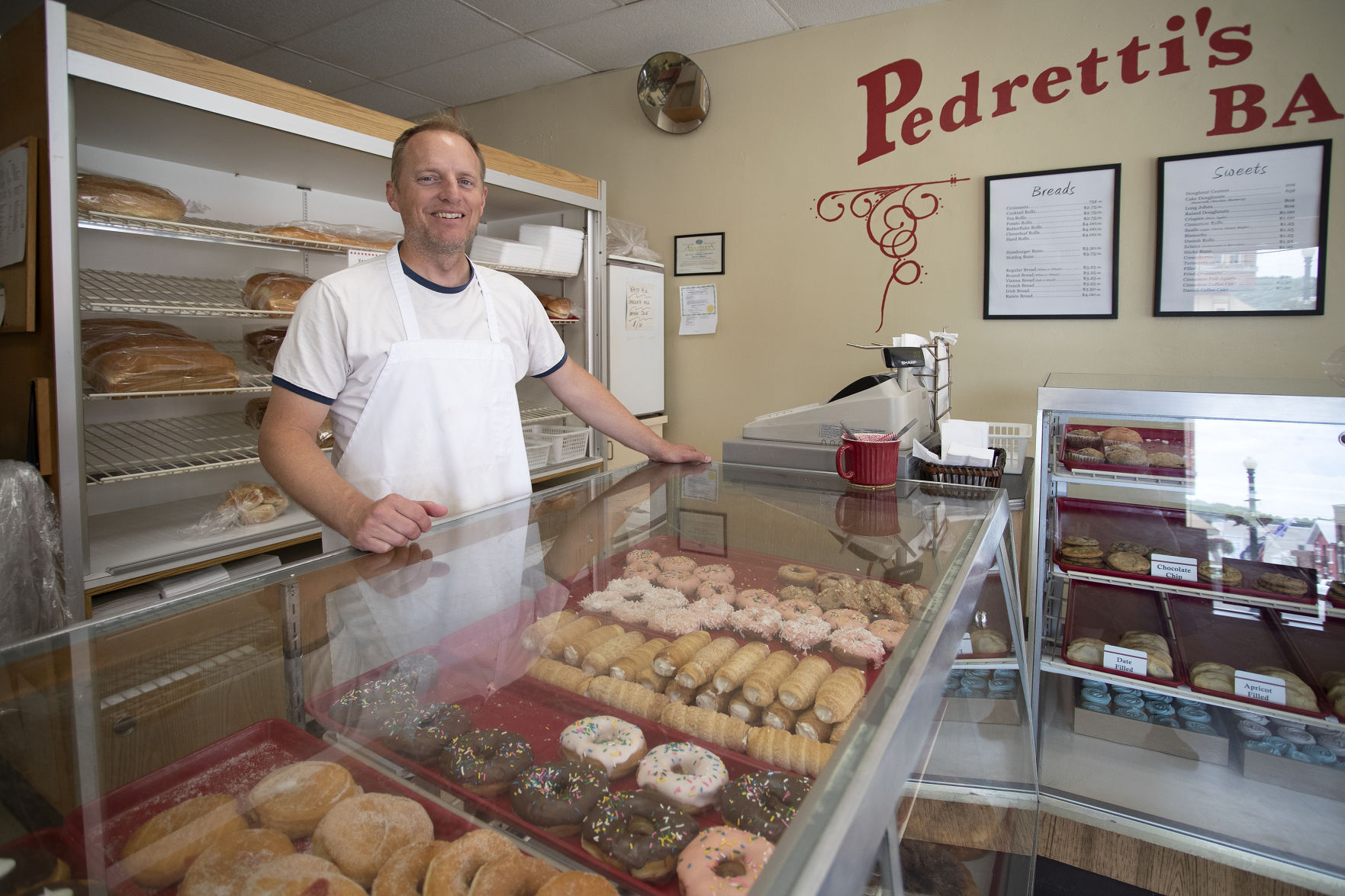 Christopher Reimer is the third generation to own Pedrettis Bakery in Elkader, Iowa. Elkader will be celebrating its 175th Anniversary and Founders Day Celebration on Saturday, June 19.    PHOTO CREDIT: Stephen Gassman