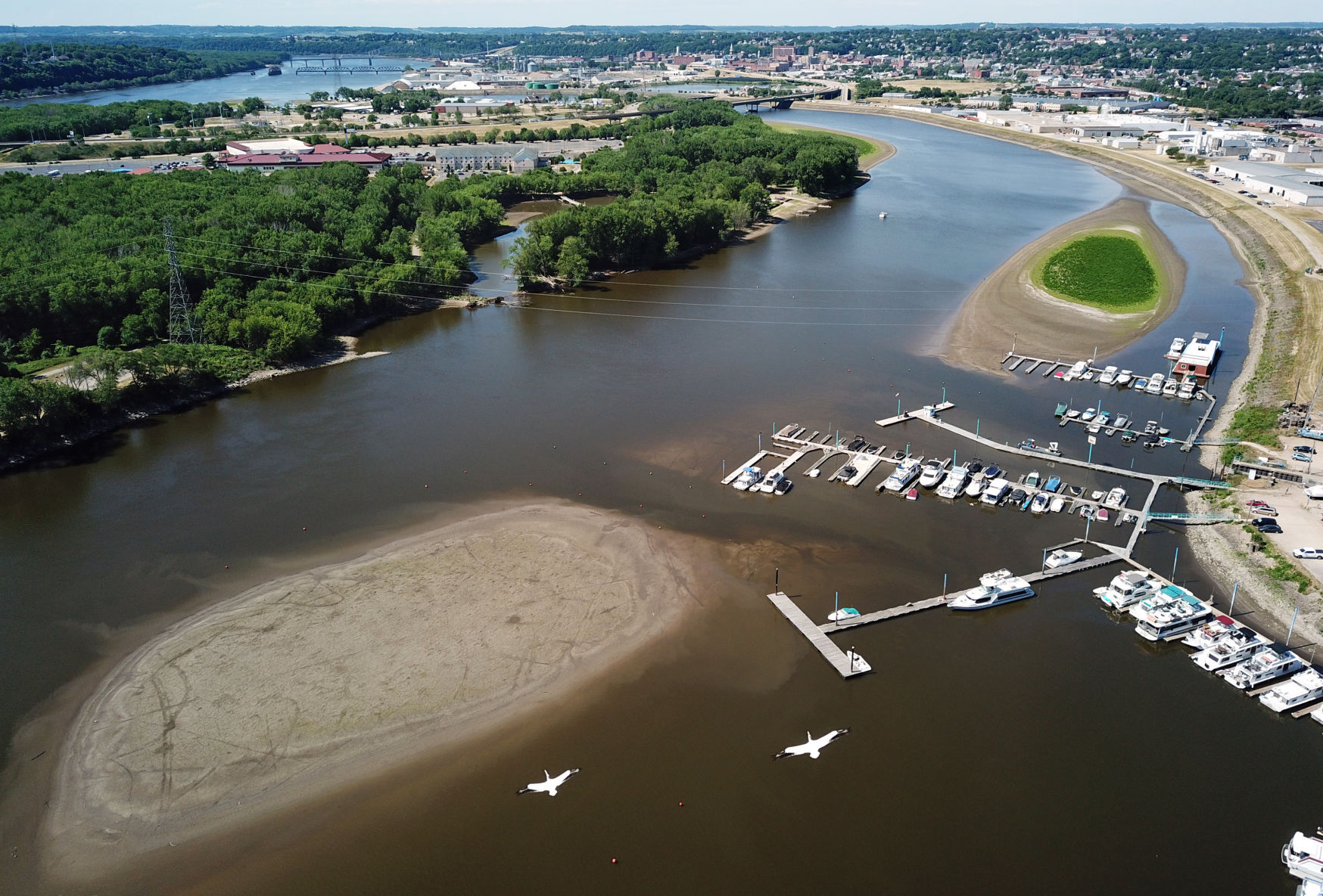 A Mississippi River sandbar is exposed in Dubuque’s Peosta Channel on Monday.    PHOTO CREDIT: JESSICA REILLY