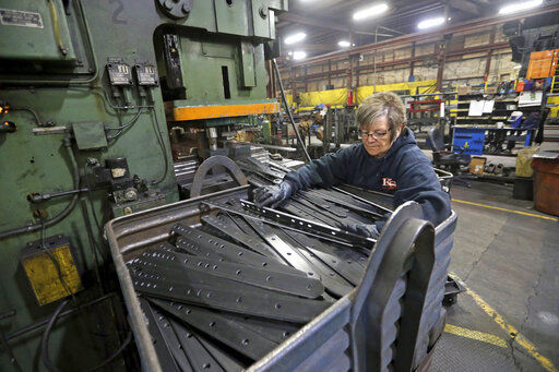 Marie Tibbott sorts product at EIP Manufacturing in Earlville, Iowa. Wholesale prices, boosted by rising food costs, increased 0.8% in May, and are up by a record amount during the past year, another indication that inflation pressures are rising since the economy has begun to re-open following the pandemic lockdowns. PHOTO CREDIT: Jessica Reilly