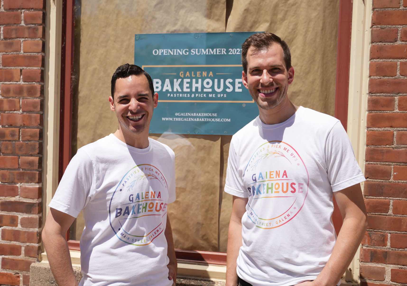 Owners, Alex Arroyo (left) and Geoff Karnish stand infront of the storefront of Galena Bakehouse at 421 S. Main St. in Galena, Ill. They plan to be open for business in early August. Photo taken on Saturday, June 19, 2021.    PHOTO CREDIT: PAUL KURUTSIDES