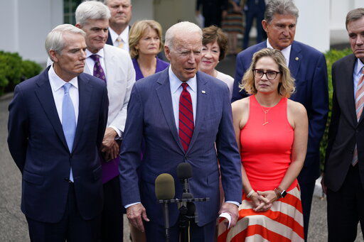 President Joe Biden, with a bipartisan group of Senators, speaks Thursday June 24, 2021, outside the White House in Washington. Biden invited members of the group of 21 Republican and Democratic senators to discuss the infrastructure plan. (AP Photo/Evan Vucci) PHOTO CREDIT: Evan Vucci