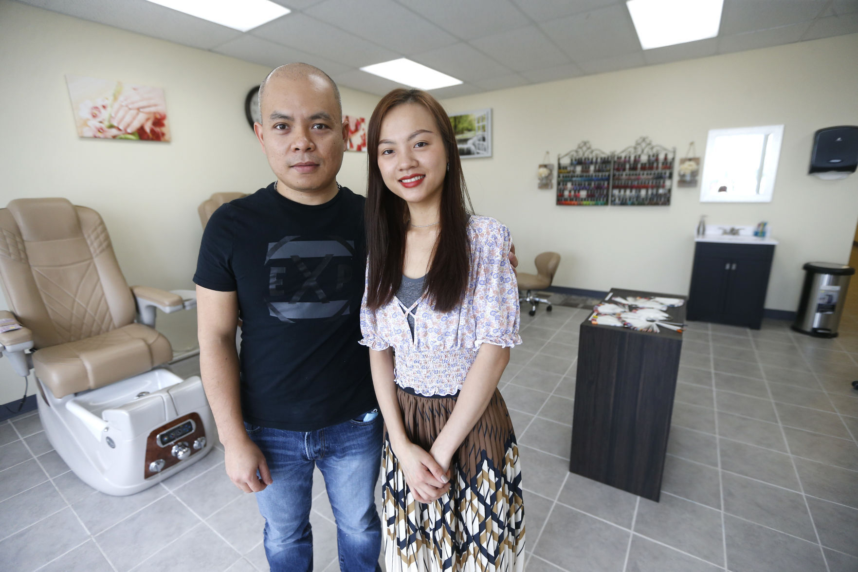 Tony Phan and his wife, Kim Chi Nguyen, are the owners of Kim Nails & Spa in Dyersville, Iowa.    PHOTO CREDIT: Dave Kettering