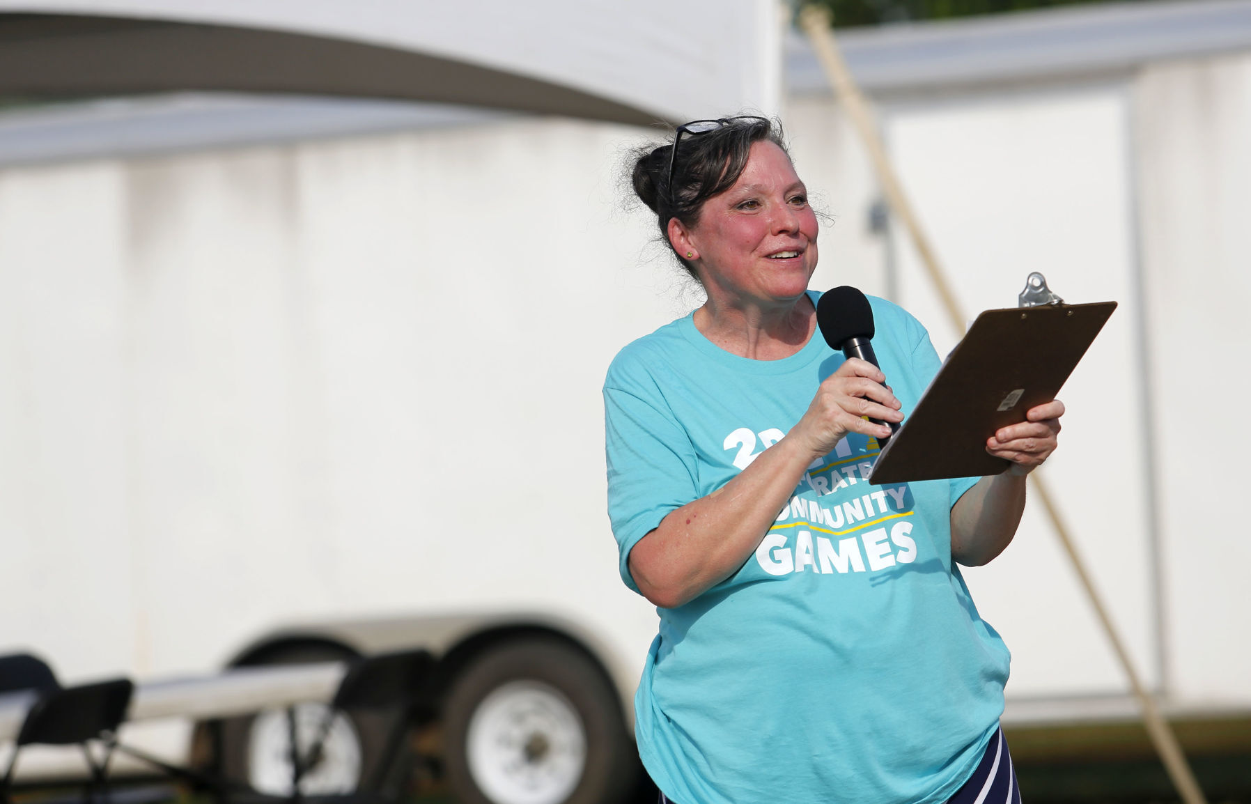 Area Residential Care Executive Director Sue Freeman gives opening remarks to local businesses that teamed up and competed at the Area Residential Care Corporate and Community Games at the Port of Dubuque on Friday, June 11. Photos by Katie Goodale    PHOTO CREDIT: Katie Goodale