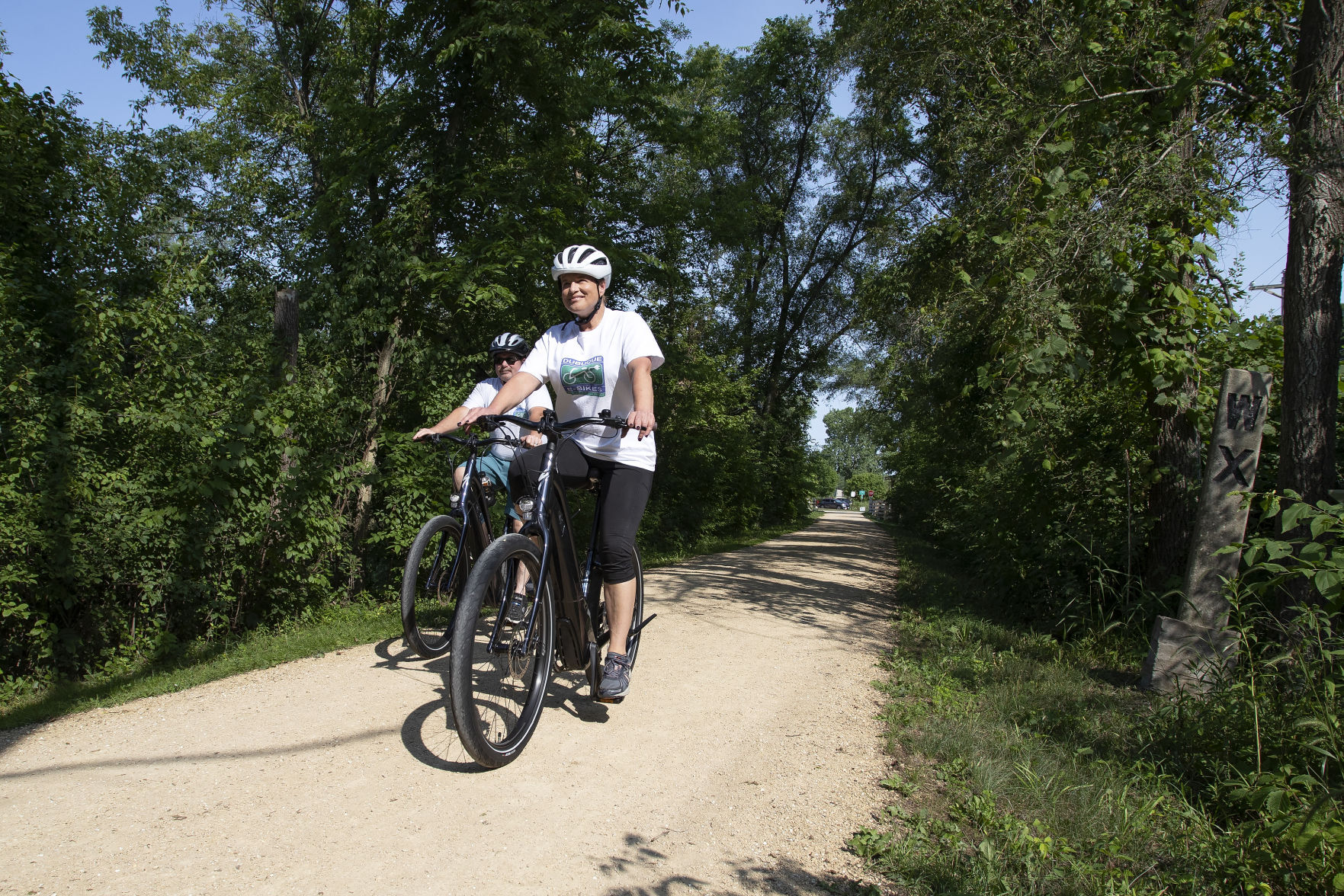 Sherri and John Driscoll ride along Herritage Trail with two of the electric assist bikes available to rent from their company Dubuque E-Bikes on Friday, July 2, 2021.    PHOTO CREDIT: Stephen Gassman