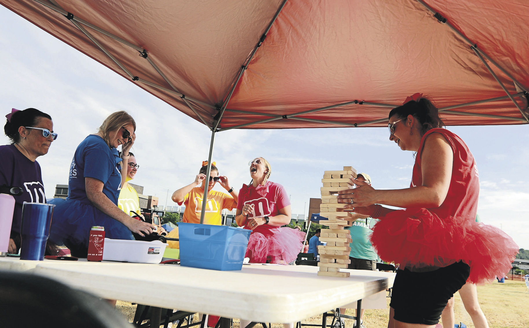 Sarah Adams (right) with Unified Therapy Services does Jenga at the Area Residential Care Corporate and Community game night at the Port of Dubuque on Friday, June 11, 2021.    PHOTO CREDIT: Katie Goodale