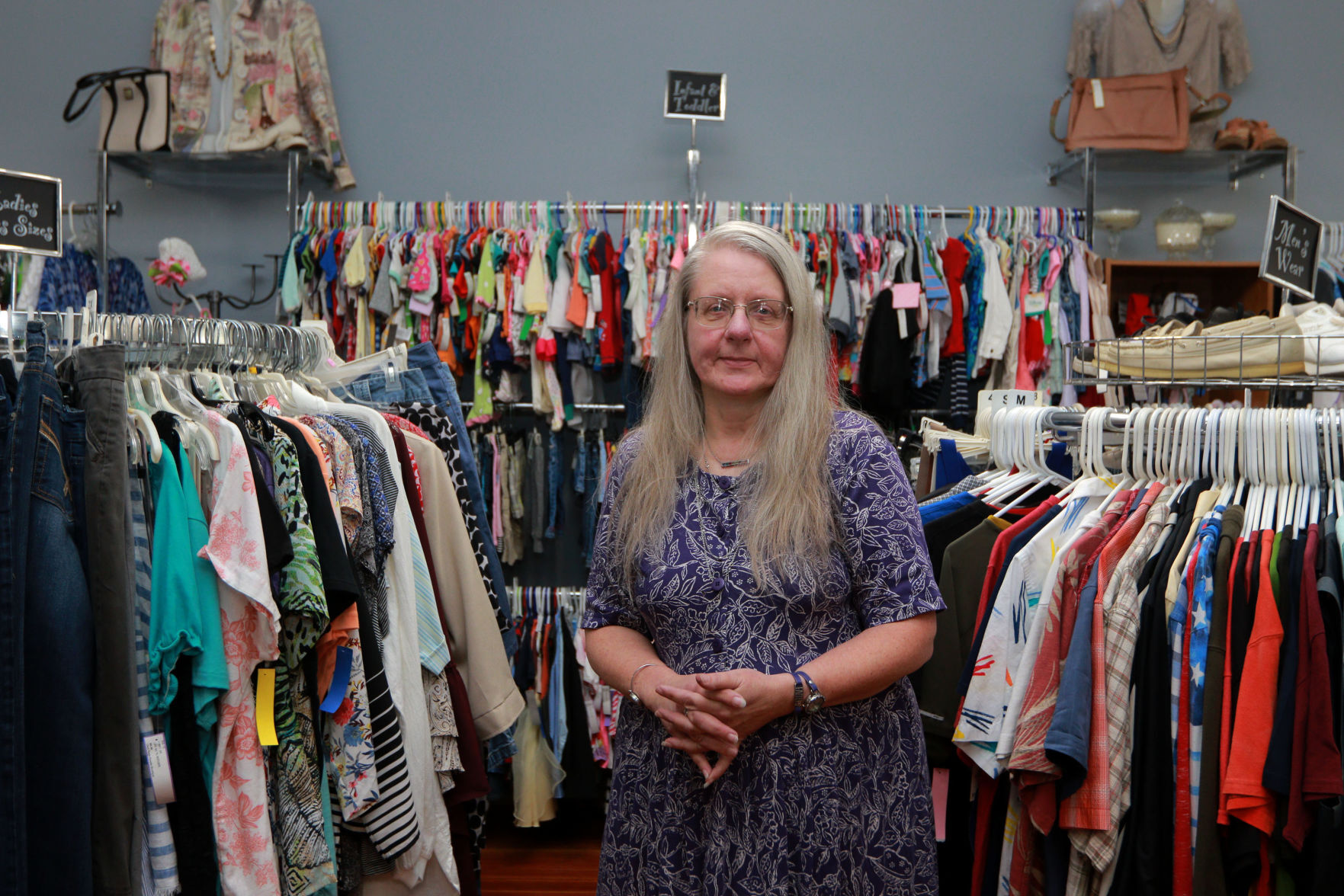 Gloria Benson, owner of Glad Rags Boutique, stands inside the store in Stockton, Ill., on Friday, July 9, 2021.    PHOTO CREDIT: Katie Goodale