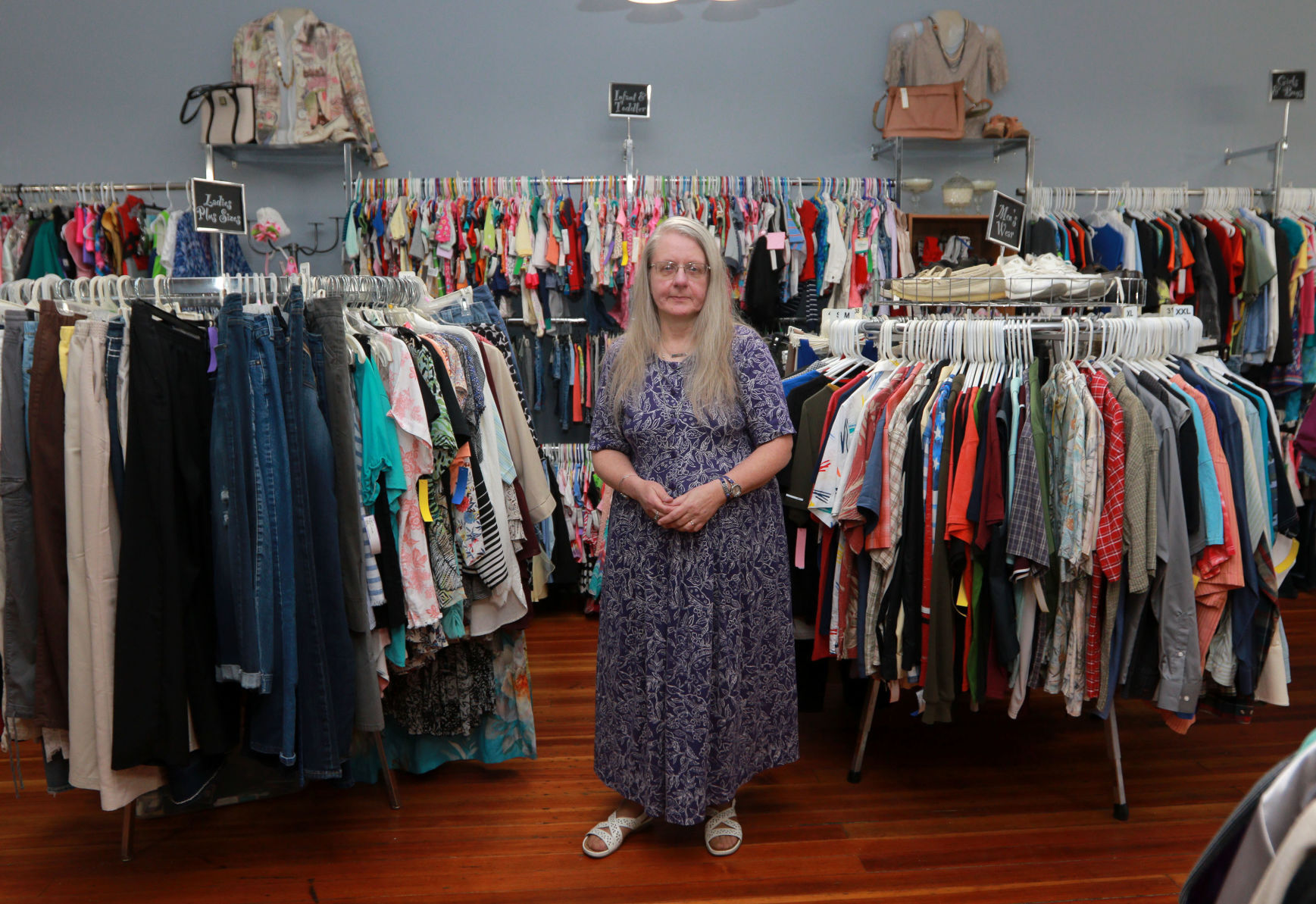 Gloria Benson, owner of Glad Rags Boutique, stands inside the store in Stockton, Ill., on Friday, July 9, 2021.    PHOTO CREDIT: Katie Goodale