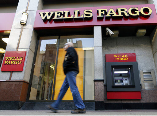 Wells Fargo & Co. swung to a profit of $6 billion in the second quarter, after reporting a loss in the same period a year earlier. PHOTO CREDIT: Matt Rourke