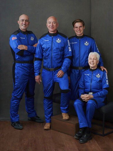 In this photo provided by Blue Origin (from left to right) Mark Bezos, brother of Jeff Bezos; Jeff Bezos, founder of Amazon and space tourism company Blue Origin; Oliver Daemen, of the Netherlands; and Wally Funk, aviation pioneer from Texas, pose for a photo. Jeff Bezos is about to soar on his space travel company’s first flight with people on board. PHOTO CREDIT: Blue Origin via AP