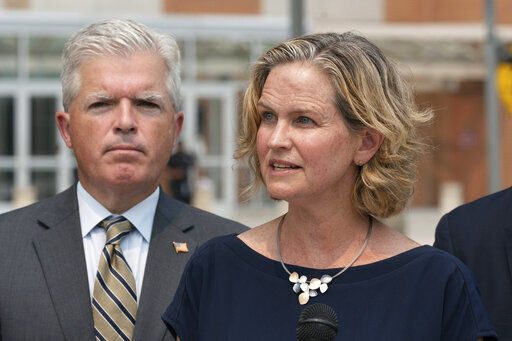 Nassau County Executive Laura Curran, right, speaks at a news conference to discuss a settlement in an opioid trial, Tuesday, July 20, 2021, in Central Islip, N.Y. Suffolk County Executive Steve Bellone is behind her. New York State reached an agreement Tuesday with the distribution companies AmerisourceBergen, Cardinal Health and McKesson to settle an ongoing trial. That deal alone would generate more than $1 billion to abate the damage done by opioids there. The trial is expected to continue, but the settlement leaves only three drug manufacturers as defendants. (AP Photo/Mark Lennihan)    PHOTO CREDIT: Mark Lennihan