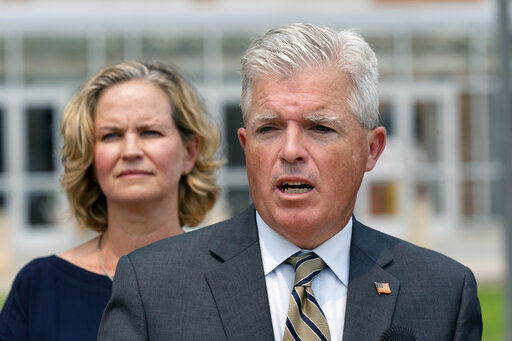 Suffolk County Executive Steve Bellone, right, speaks at a news conference to discuss a settlement in an opioid trial, Tuesday, July 20, 2021, in Central Islip, N.Y. Nassau County Executive Laura Curran is behind him. New York State reached an agreement Tuesday with the distribution companies AmerisourceBergen, Cardinal Health and McKesson to settle an ongoing trial. That deal alone would generate more than $1 billion to abate the damage done by opioids there. The trial is expected to continue, but the settlement leaves only three drug manufacturers as defendants. (AP Photo/Mark Lennihan)    PHOTO CREDIT: Mark Lennihan