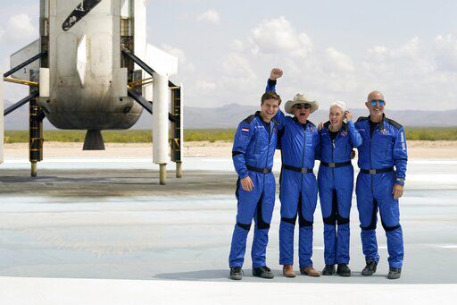 Oliver Daemen, from left, Jeff Bezos, founder of Amazon and space tourism company Blue Origin, Wally Funk and Bezos